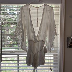 Love stitch white romper. NWT. Size Large.